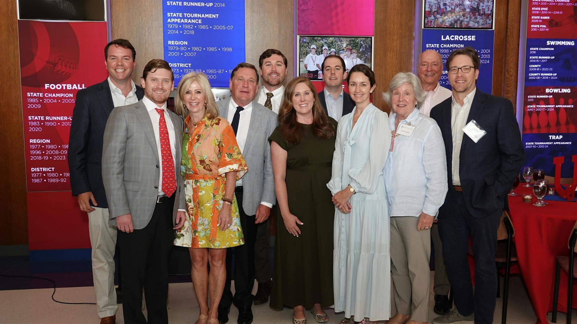 group of people posing in formal attire