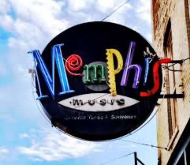 MUS logo on building facade.