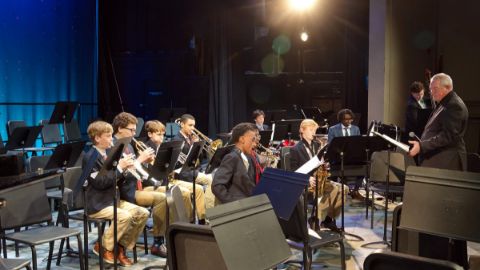 Brass section of orchestra concert.