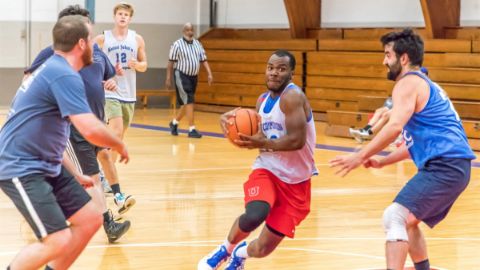 Alumni playing basketball 16