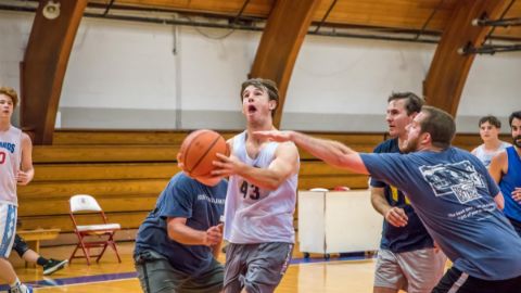 Alumni playing basketball 26