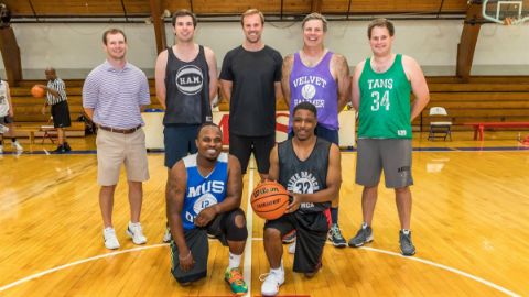 Alumni playing basketball 13