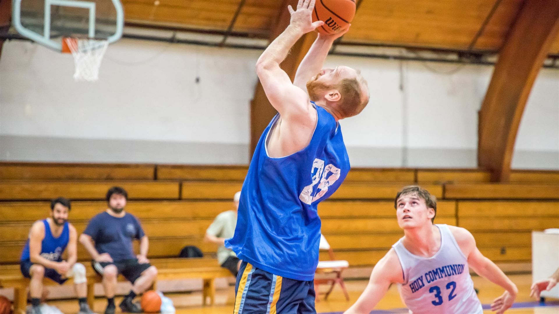 Alumni playing basketball 6