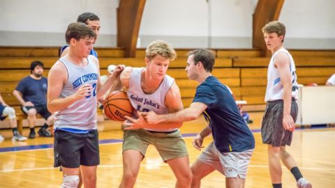Alumni playing basketball 20