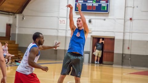 Alumni playing basketball 12