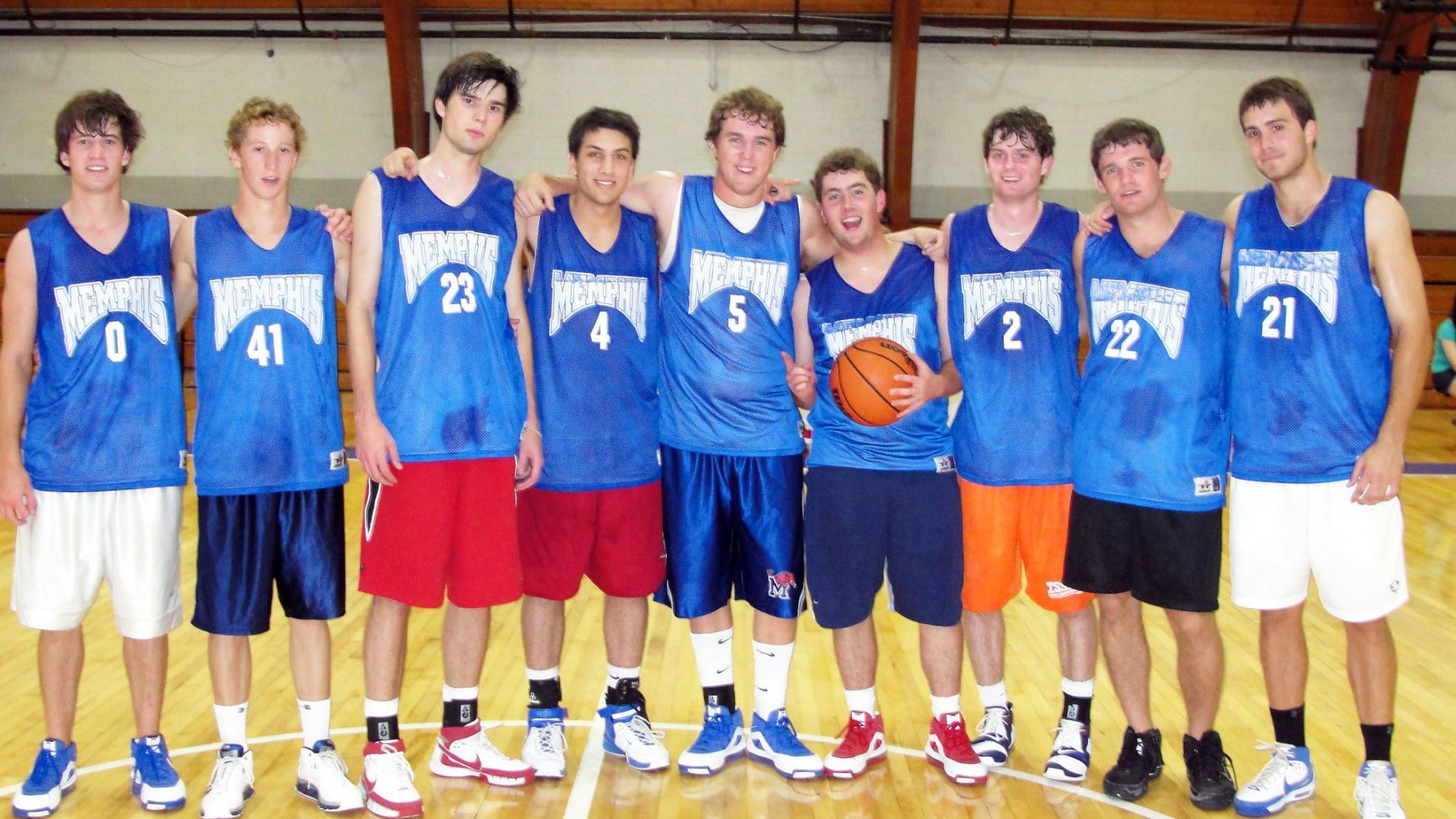 Alumni playing basketball 23