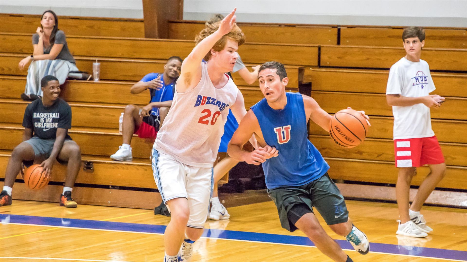 Alumni playing basketball 24
