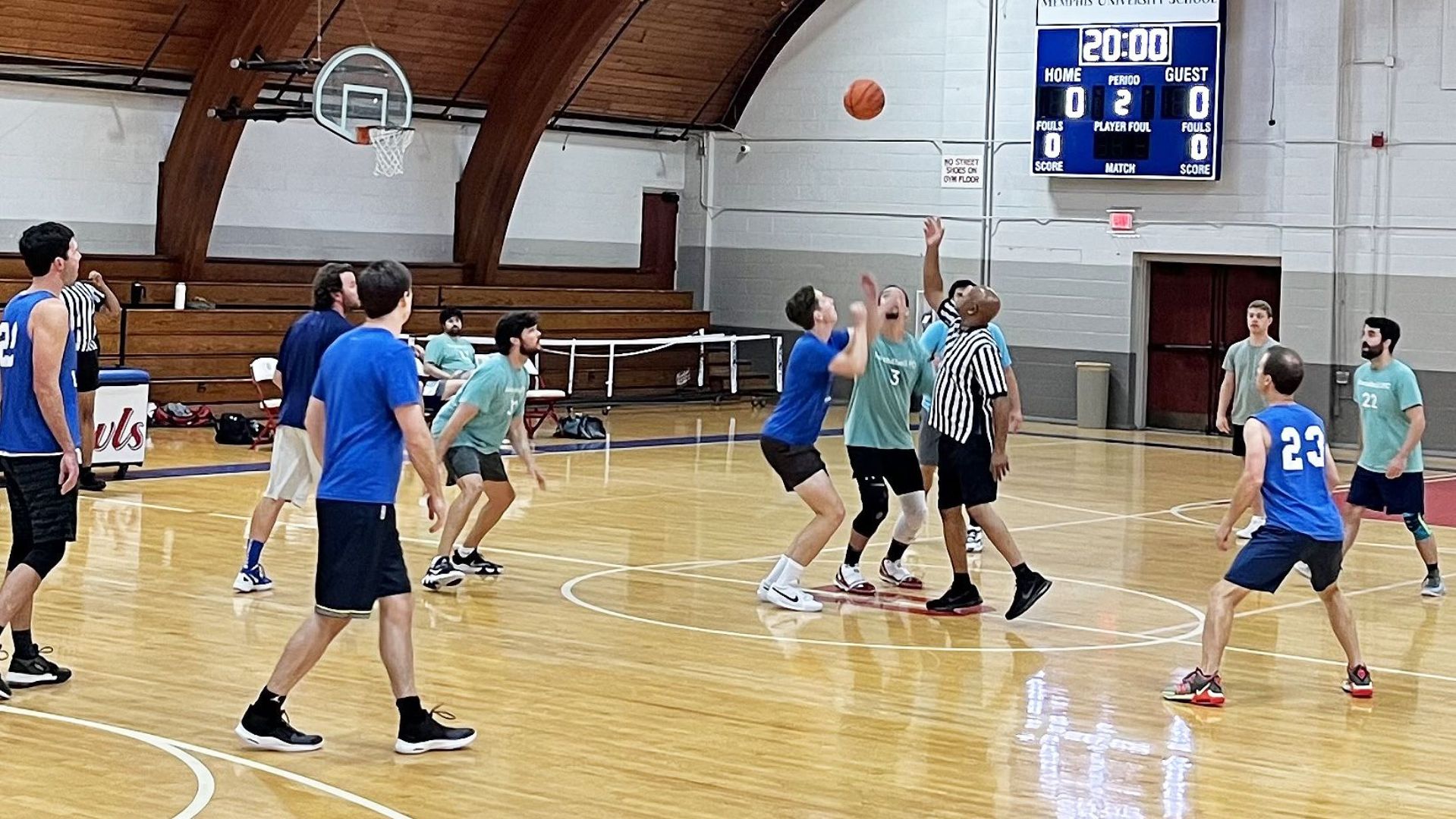 Alumni playing basketball 21