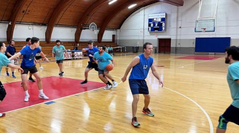 Alumni playing basketball 14