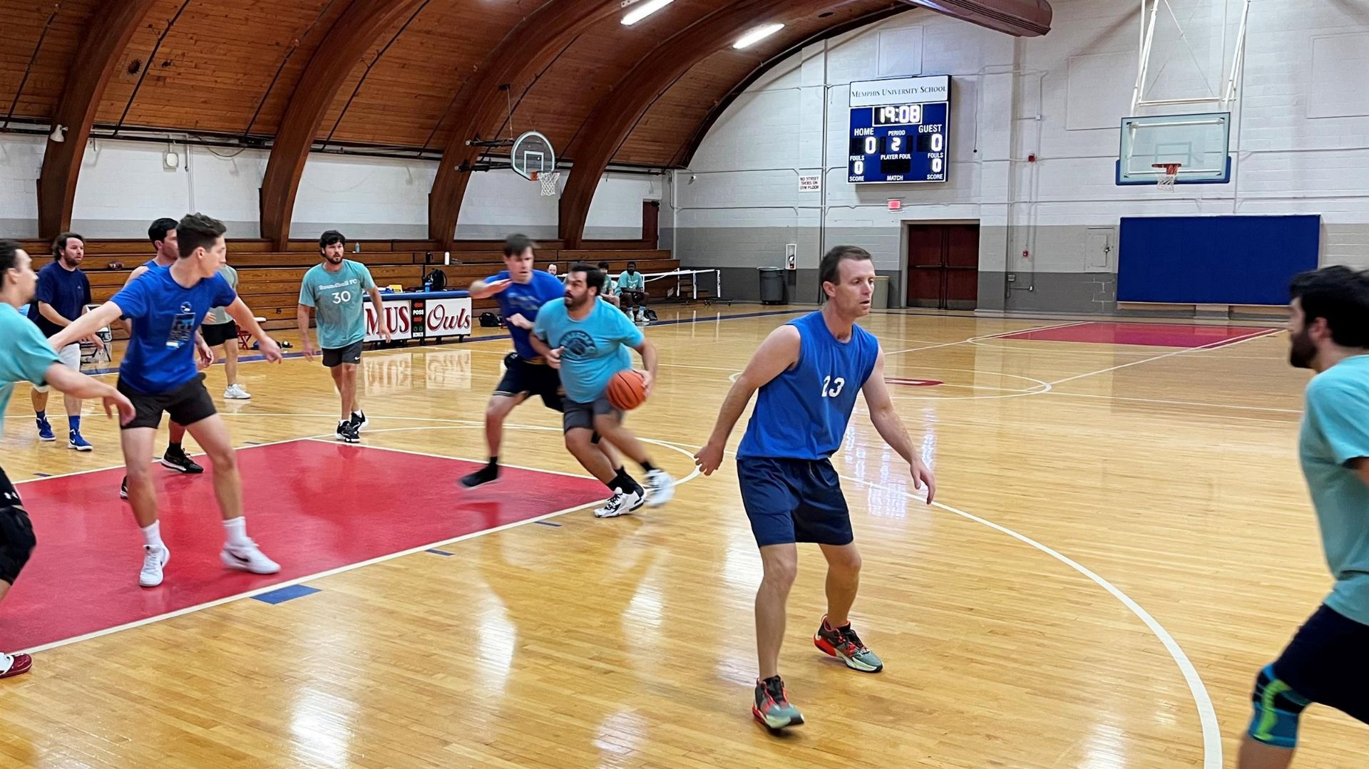 Alumni playing basketball 14