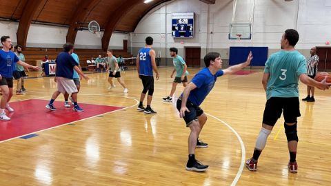 Alumni playing basketball 25