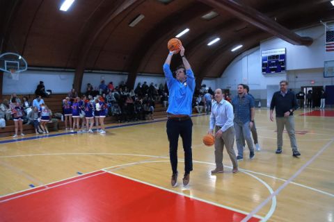 men lining up shooting basketball 